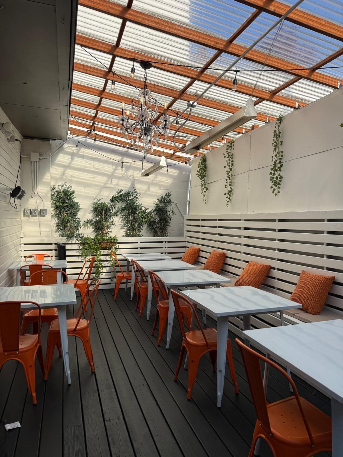 Patio long view with banquette and pillows